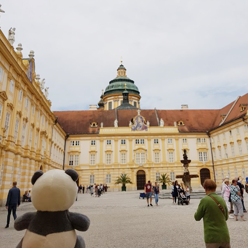 Plushie panda Mister Wong at the square inside of Melk Abbey.