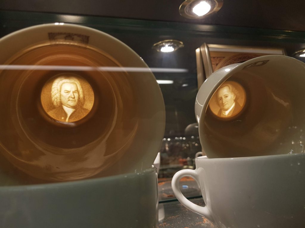 Coffee cups with engravings on the bottom in the Viennese Coffee Museum in Vienna, Austria.