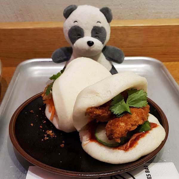 Devouring two delicious Bao.